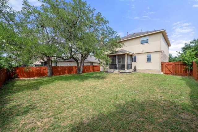 145 Trinity Dr, Kyle, TX 78640 - rear view of house with a sunroom and stucco siding