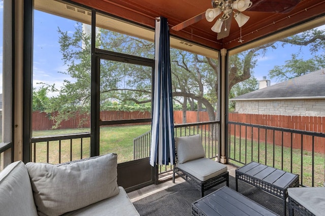 145 Trinity Dr, Kyle, TX 78640 - sunroom featuring a ceiling fan, an outdoor hangout area, and healthy amount of natural light