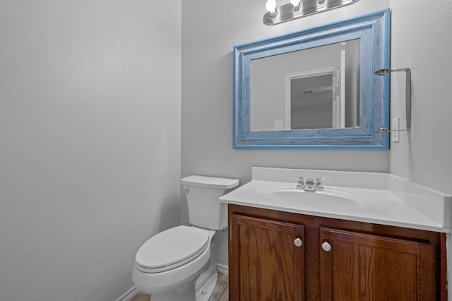 145 Trinity Dr, Kyle, TX 78640 - bathroom with vanity, toilet, and baseboards