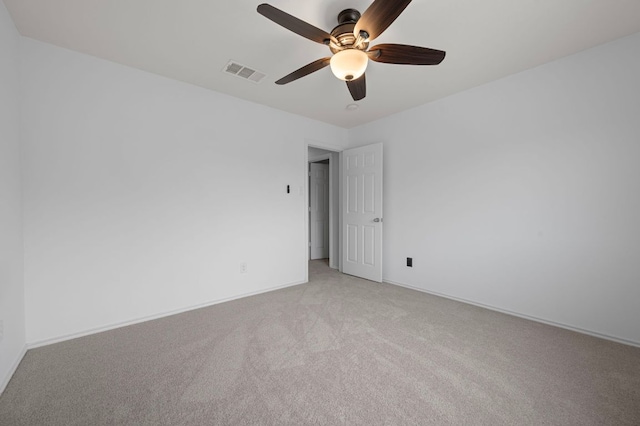 145 Trinity Dr, Kyle, TX 78640 - empty room with light colored carpet, a ceiling fan, and baseboards