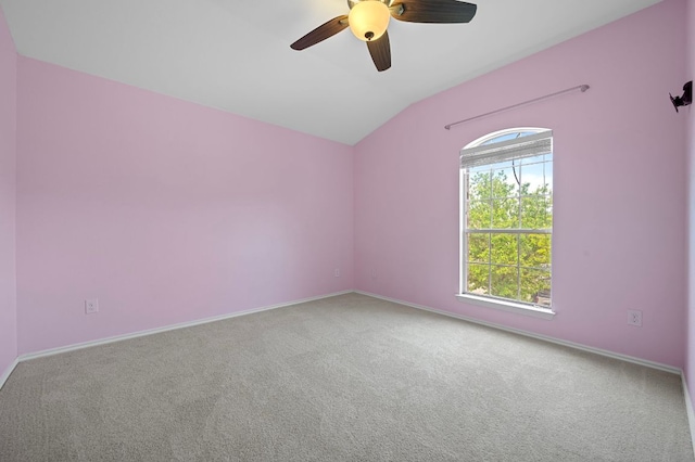 145 Trinity Dr, Kyle, TX 78640 - spare room featuring carpet flooring, ceiling fan, lofted ceiling, and baseboards