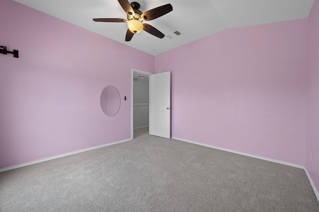 145 Trinity Dr, Kyle, TX 78640 - unfurnished bedroom featuring carpet floors, baseboards, lofted ceiling, and ceiling fan