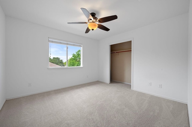 145 Trinity Dr, Kyle, TX 78640 - unfurnished bedroom with carpet, a closet, a ceiling fan, and baseboards