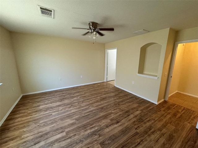 12000 Briarcreek Loop, Manor, TX 78653 - empty room featuring ceiling fan, dark wood-style floors, and baseboards