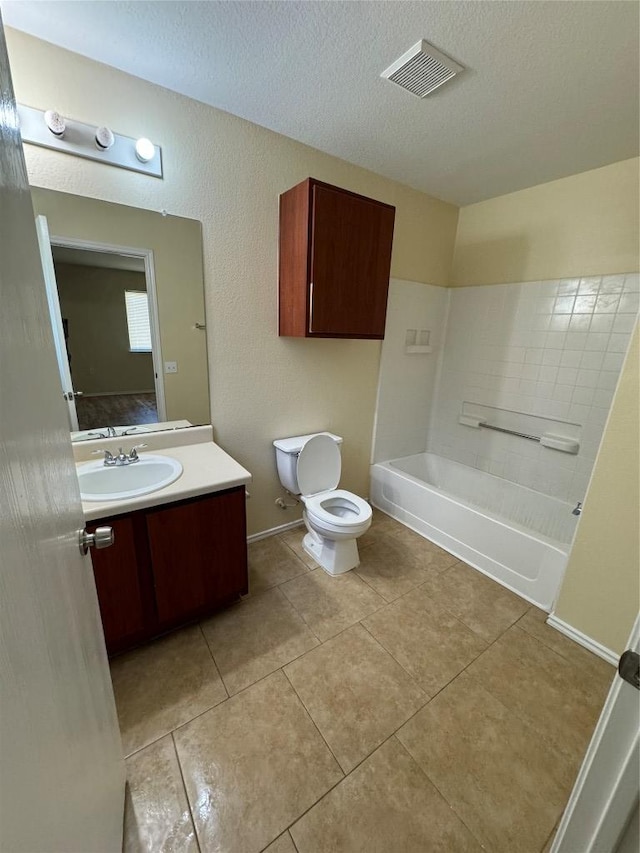 12000 Briarcreek Loop, Manor, TX 78653 - full bathroom featuring toilet, vanity, a bathtub, a textured ceiling, and tile patterned flooring