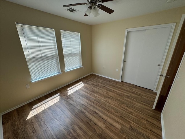12000 Briarcreek Loop, Manor, TX 78653 - unfurnished bedroom with wood finished floors, a closet, baseboards, and a ceiling fan