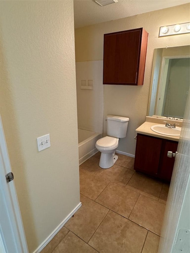 12000 Briarcreek Loop, Manor, TX 78653 - full bath featuring vanity, tile patterned flooring, toilet, bathing tub / shower combination, and a textured wall