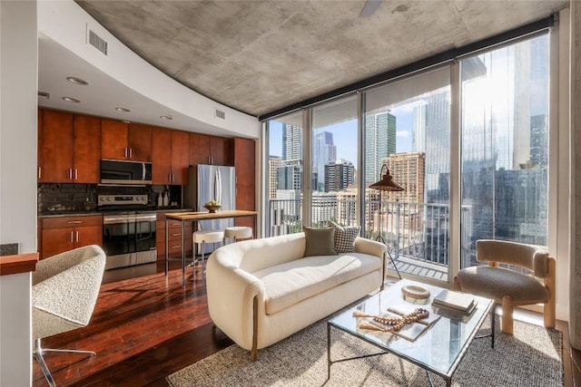 360 Nueces St Unit 1503, Austin, TX 78701 - living area featuring expansive windows, dark wood finished floors, and a view of skyline