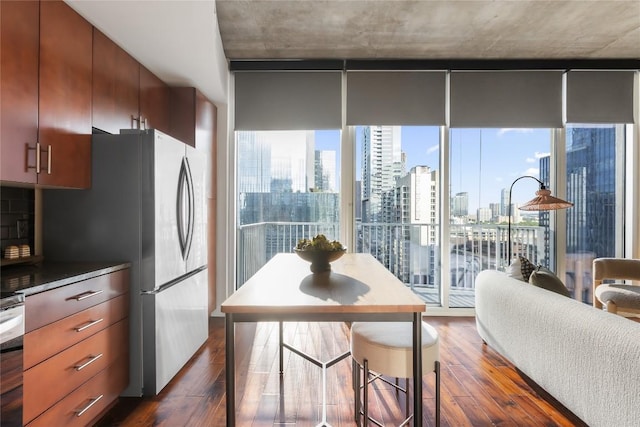 360 Nueces St Unit 1503, Austin, TX 78701 - kitchen featuring dark wood-type flooring, a view of skyline, and tasteful backsplash