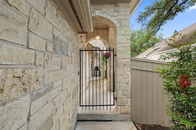 16 Troon Dr, Lakeway, TX 78738 - property entrance with stone siding and a gate