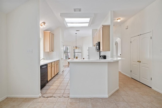16 Troon Dr, Lakeway, TX 78738 - kitchen featuring black appliances, light tile patterned floors, light brown cabinetry, and light countertops