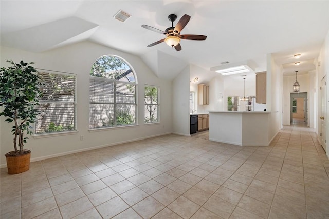16 Troon Dr, Lakeway, TX 78738 - unfurnished living room featuring healthy amount of natural light, light tile patterned flooring, ceiling fan, and vaulted ceiling