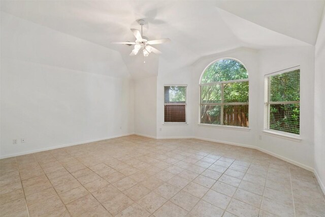 16 Troon Dr, Lakeway, TX 78738 - unfurnished room with light tile patterned flooring, a ceiling fan, lofted ceiling, and baseboards
