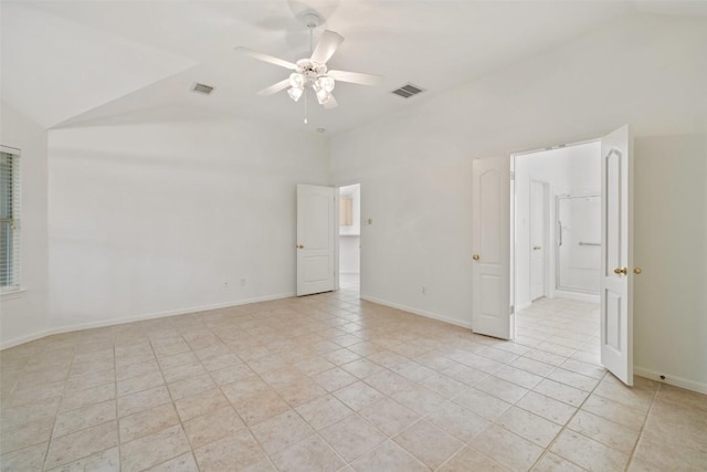 16 Troon Dr, Lakeway, TX 78738 - empty room featuring vaulted ceiling, a ceiling fan, light tile patterned flooring, and baseboards