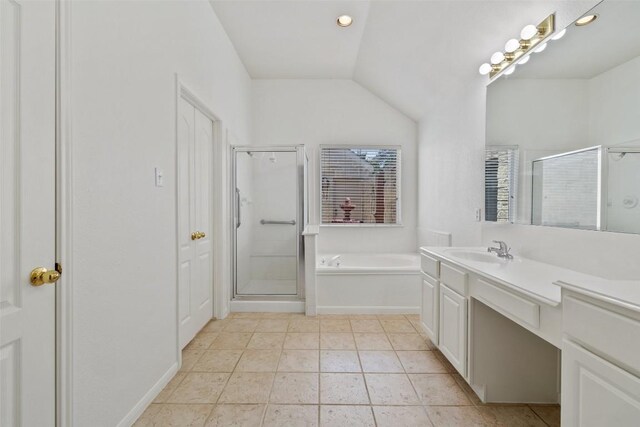16 Troon Dr, Lakeway, TX 78738 - bathroom featuring vanity, vaulted ceiling, a garden tub, a stall shower, and recessed lighting