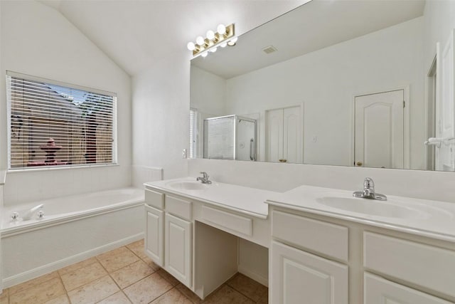 16 Troon Dr, Lakeway, TX 78738 - bathroom featuring double vanity, a stall shower, a garden tub, lofted ceiling, and tile patterned floors