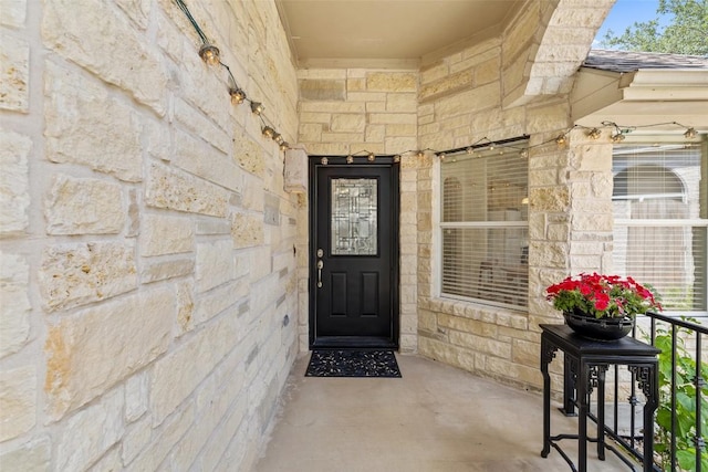 16 Troon Dr, Lakeway, TX 78738 - property entrance featuring stone siding