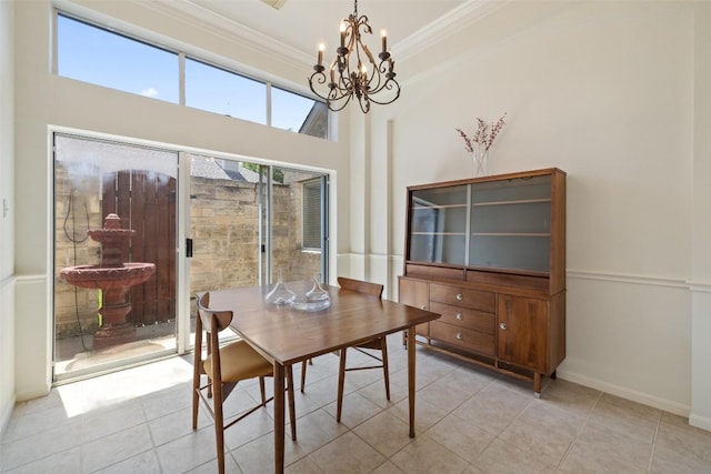 16 Troon Dr, Lakeway, TX 78738 - dining room with a chandelier, crown molding, and light tile patterned flooring