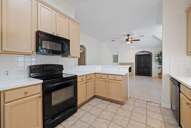 16 Troon Dr, Lakeway, TX 78738 - kitchen with black appliances, light brown cabinets, arched walkways, a ceiling fan, and a peninsula