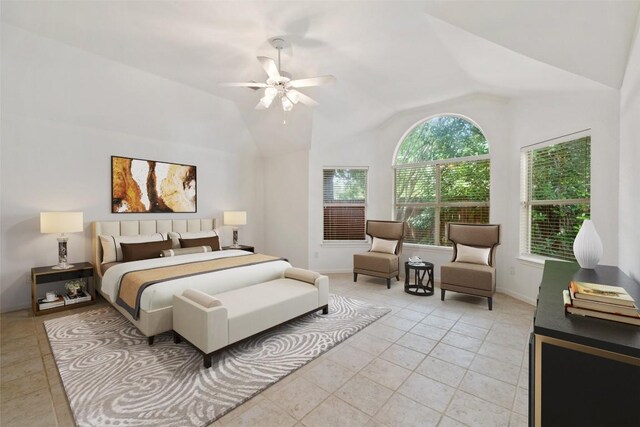 16 Troon Dr, Lakeway, TX 78738 - bedroom featuring vaulted ceiling, baseboards, a ceiling fan, and light tile patterned floors