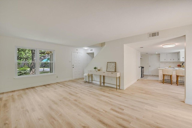 8011 Scotland Yard, Austin, TX 78759 - living room with light wood-style floors and stairs
