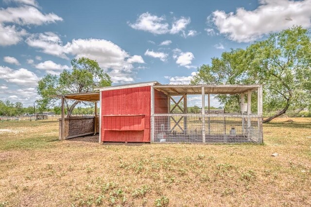 701 W Steele St, Smiley, TX 78159 - view of poultry coop featuring a lawn