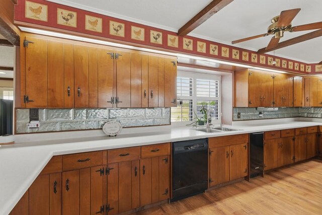 701 W Steele St, Smiley, TX 78159 - kitchen with black dishwasher, a sink, light countertops, backsplash, and brown cabinetry