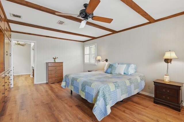 701 W Steele St, Smiley, TX 78159 - bedroom with beam ceiling, wood finished floors, a ceiling fan, and ornamental molding