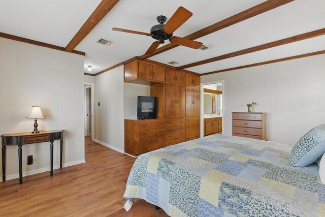 701 W Steele St, Smiley, TX 78159 - bedroom with beam ceiling, wood finished floors, baseboards, and a ceiling fan