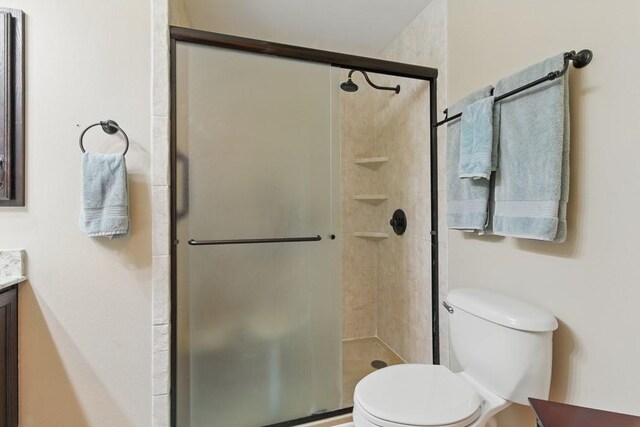 701 W Steele St, Smiley, TX 78159 - bathroom with vanity, toilet, and a shower stall