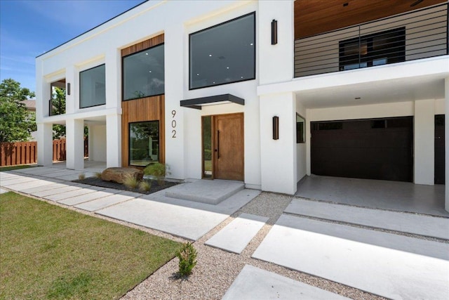 902 Challenger St, Lakeway, TX 78734 - view of front facade with a garage, concrete driveway, and stucco siding