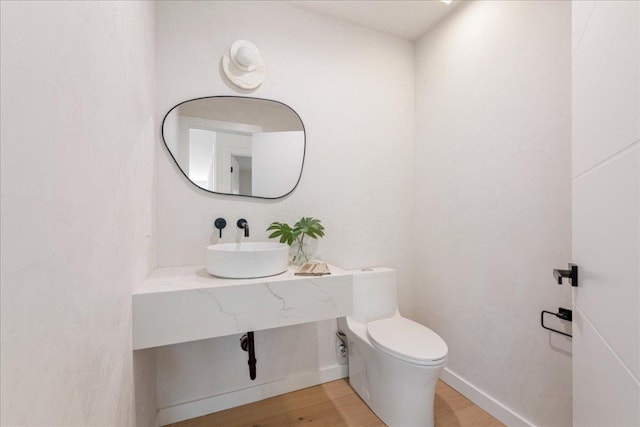 902 Challenger St, Lakeway, TX 78734 - half bathroom featuring wood finished floors and vanity