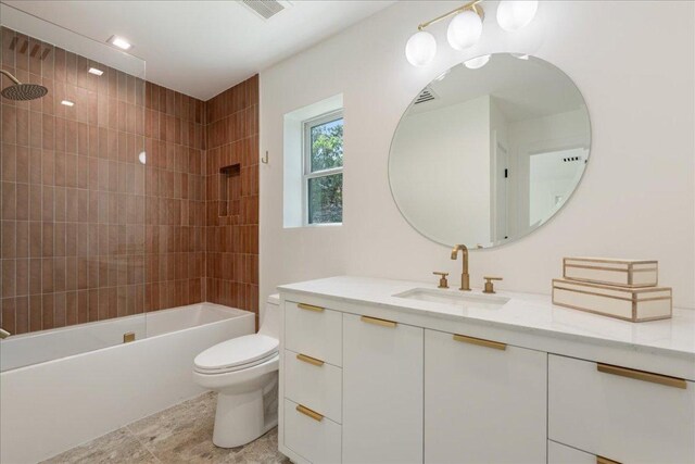 902 Challenger St, Lakeway, TX 78734 - bathroom with vanity, toilet, shower / tub combination, and tile patterned floors