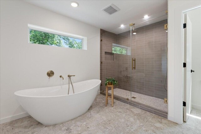 902 Challenger St, Lakeway, TX 78734 - bathroom with a freestanding tub, a shower stall, recessed lighting, and baseboards