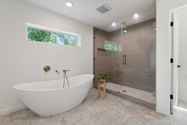 902 Challenger St, Lakeway, TX 78734 - full bath with a soaking tub, a stall shower, and recessed lighting