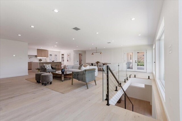 902 Challenger St, Lakeway, TX 78734 - living area featuring light wood-type flooring, recessed lighting, and french doors