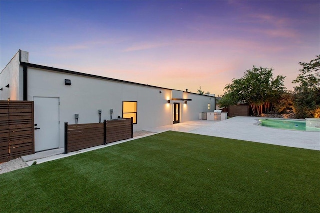 902 Challenger St, Lakeway, TX 78734 - back of house featuring stucco siding, an outdoor pool, and a patio