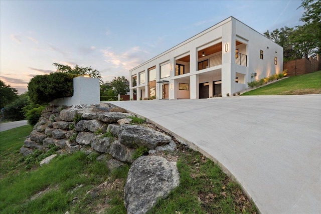 902 Challenger St, Lakeway, TX 78734 - property at dusk with a garage and driveway