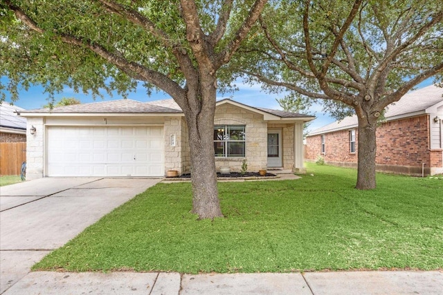 104 Lucky Clover Ln, Hutto, TX 78634 - view of front of house featuring a garage, driveway, a front lawn, and stone siding
