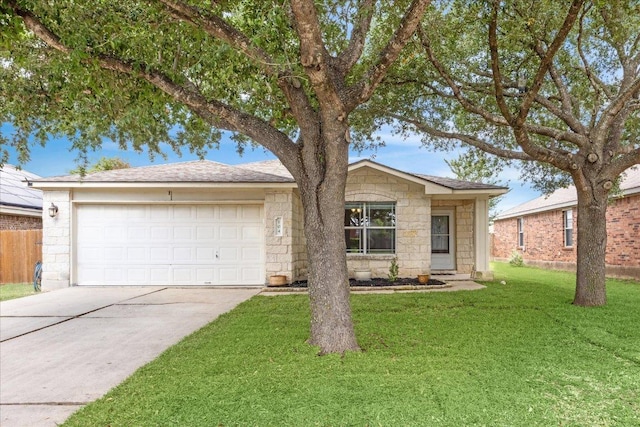 104 Lucky Clover Ln, Hutto, TX 78634 - ranch-style home with stone siding, a garage, and driveway