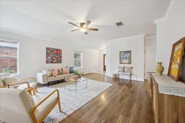 104 Lucky Clover Ln, Hutto, TX 78634 - living area featuring ornamental molding, a ceiling fan, dark wood-style floors, and vaulted ceiling
