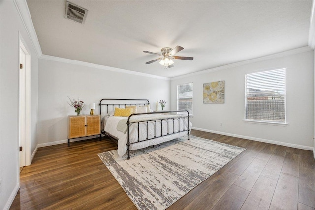 104 Lucky Clover Ln, Hutto, TX 78634 - bedroom featuring crown molding, dark wood-style floors, and a ceiling fan