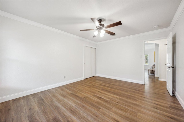 104 Lucky Clover Ln, Hutto, TX 78634 - unfurnished room with a ceiling fan, wood finished floors, crown molding, and a smoke detector