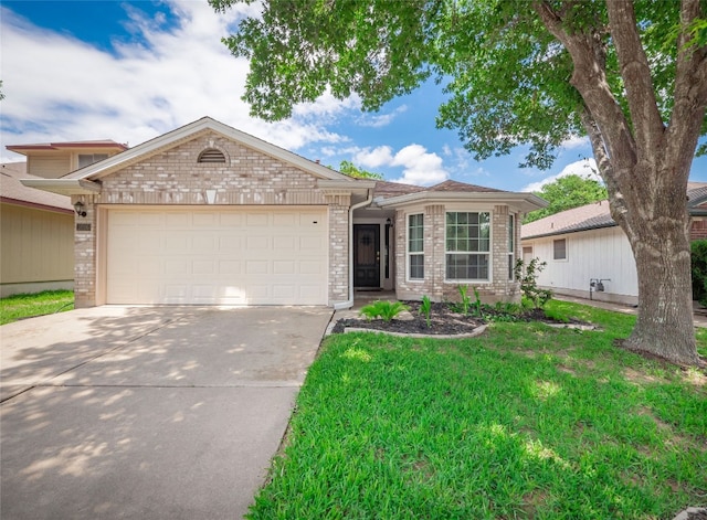 1016 Apple Cross Dr, Pflugerville, TX 78660 - ranch-style house with brick siding, concrete driveway, a garage, and a front lawn