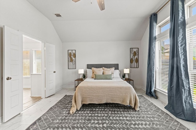 217 Magdalene Way, Liberty Hill, TX 78642 - bedroom featuring lofted ceiling, light marble finish floors, and a ceiling fan