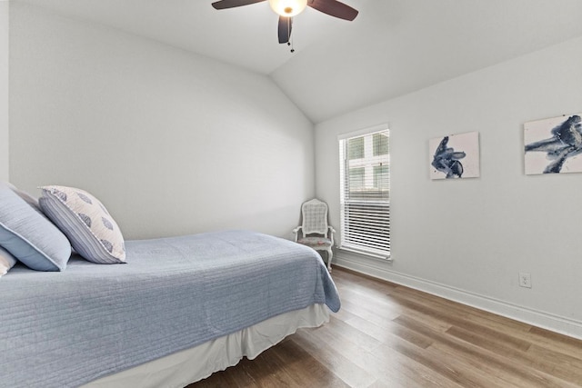 217 Magdalene Way, Liberty Hill, TX 78642 - bedroom featuring wood finished floors, ceiling fan, and lofted ceiling
