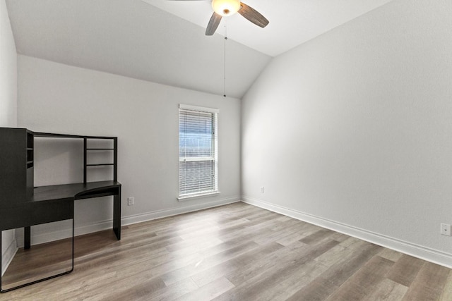 217 Magdalene Way, Liberty Hill, TX 78642 - unfurnished bedroom with lofted ceiling, wood finished floors, and a ceiling fan