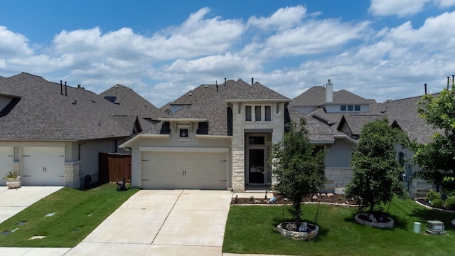 217 Magdalene Way, Liberty Hill, TX 78642 - french provincial home featuring stone siding, concrete driveway, stucco siding, and a front lawn