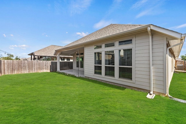 217 Magdalene Way, Liberty Hill, TX 78642 - rear view of house featuring a shingled roof