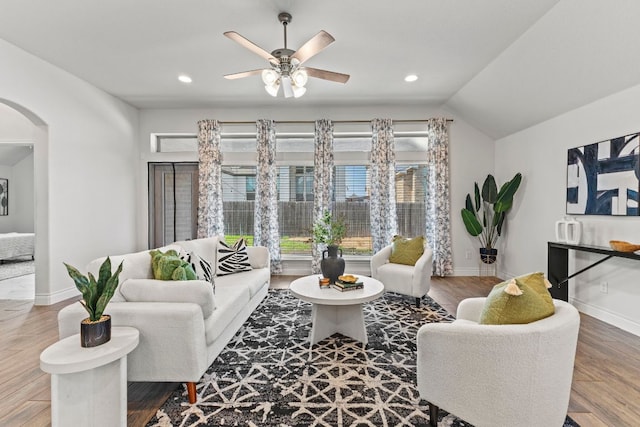 217 Magdalene Way, Liberty Hill, TX 78642 - living area featuring arched walkways, ceiling fan, recessed lighting, wood finished floors, and lofted ceiling